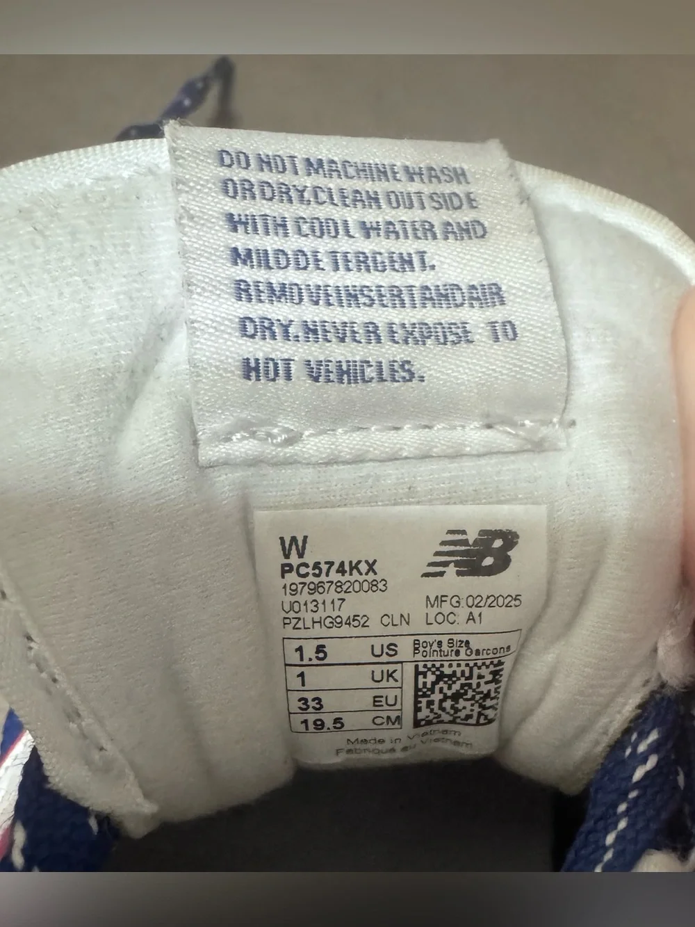 New Balance Kids' Navy Blue Sneakers with White and Red Accents